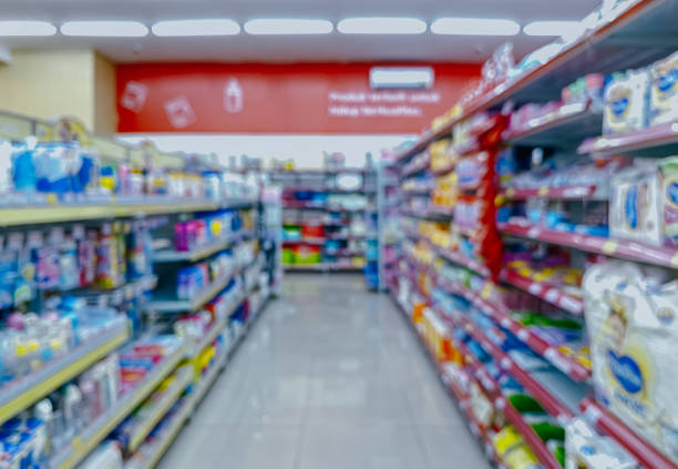 istock Supermarket aisle and shelves blurred background. 2055322898