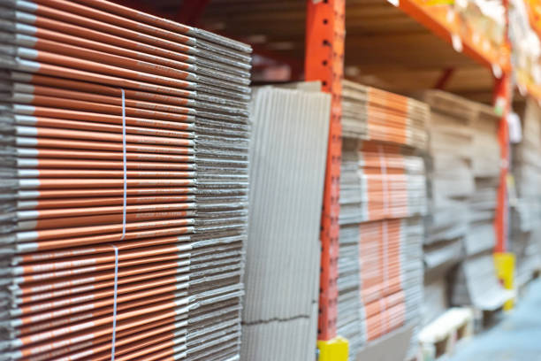 Hardware store full of folded moving boxes cardboard case on shelves rack, moving and storage supply in Dallas, TX, brand new corrugated sheets polyester in strap tied, eco-friendly recycled. USA