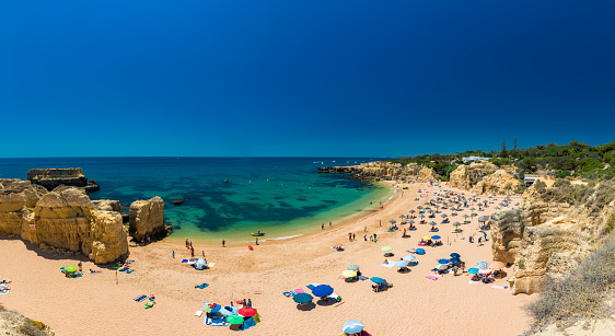 Panoramic aerial drone view of popular Praia do Castelo beach, Albufeira, Algarve, Portugal
