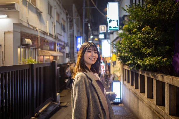 istock Young business woman going back home after work in city 2055389657