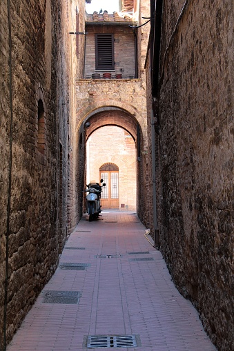 An alley in San Gimignano at midday, Tuscany