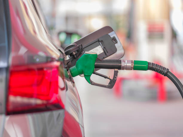 istock Pumping gas at gas pump 2055416422