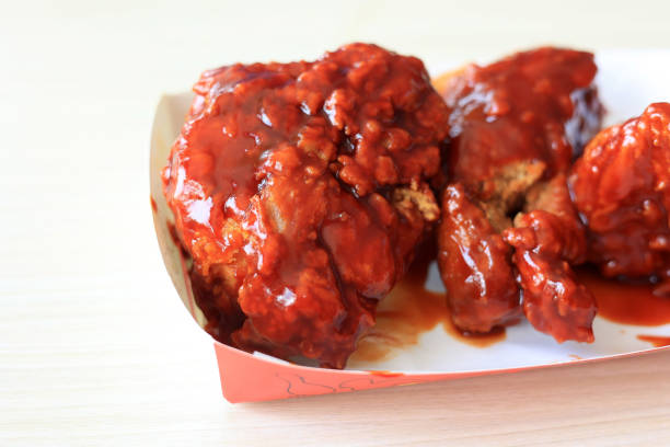 Close Up Fried Chicken with Red Spicy Barbeque Sauce, Richeese Chicken