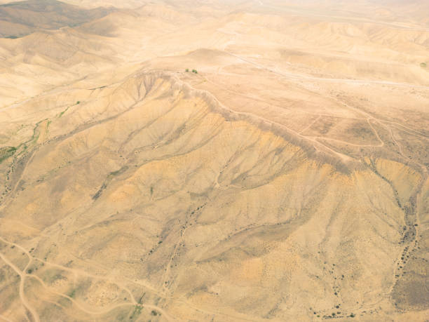 Aerial view mountain texture background. Drone view mountain valley. Beautiful view from above surface of mountain hills.