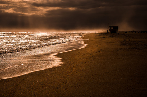 Artistic photo of peaceful beach near sunset in southern France.