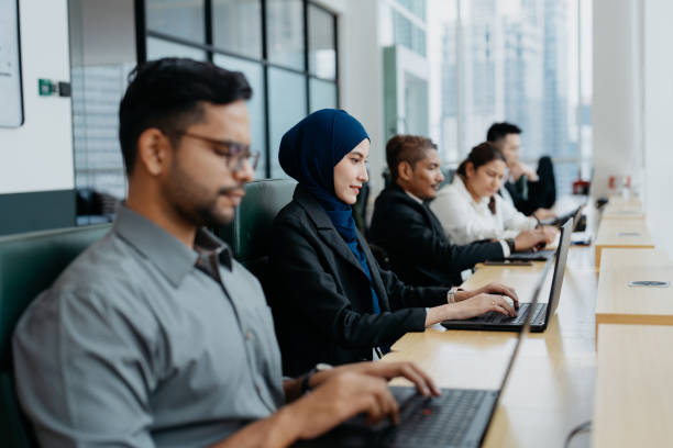istock Multiracial Asian office workers concentrate at work in office 2055525490