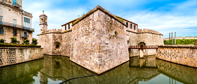Castle of the Royal Force, accompanied by the Palace of the Second Cape, a renowned travel destination in Havana old town, surrounded by a moat, inviting visitors to explore its historic allure.