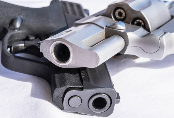 istock Two different handguns placed one on top of the other 2055552063