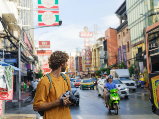 Man photographing with camera in Chinatown, Bangkok