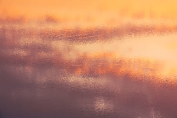 Water ripples in golden tones. Abstract background and texture for design.