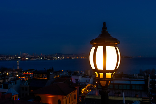 Lantern with Bosphorus on background in the night.