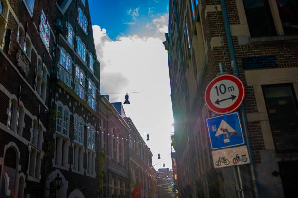 Amsterdam's buildings and streets blend picturesque canals, historic architecture, and vibrant urban life, creating a charming and iconic cityscape.