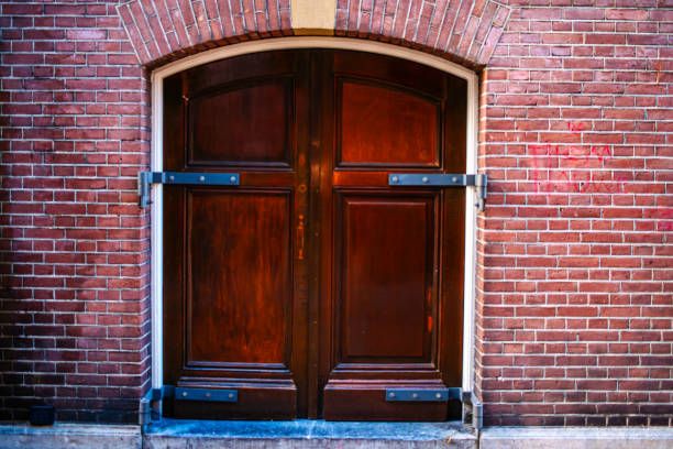 istock Timeless Entry: Door in Brick Wall in Amsterdam 2055675824