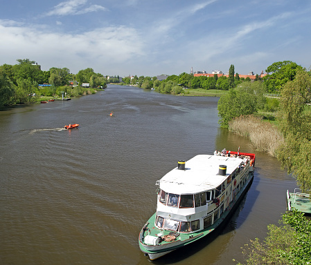 The Oder River near the city of Wroclaw, Poland - tourist cruise ship on the surface of the river