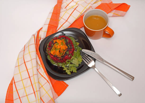 Healthy Beetroot Carrots Arugula Salad Breakfast Served With Orange Juice in Mug