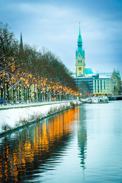 Christmas-lit Ballindamm towards the town hall in Hamburg View along the Christmas-lit Ballindamm towards the town hall in Hamburg, reflections in the water, vertically sterne stock pictures, royalty-free photos & images