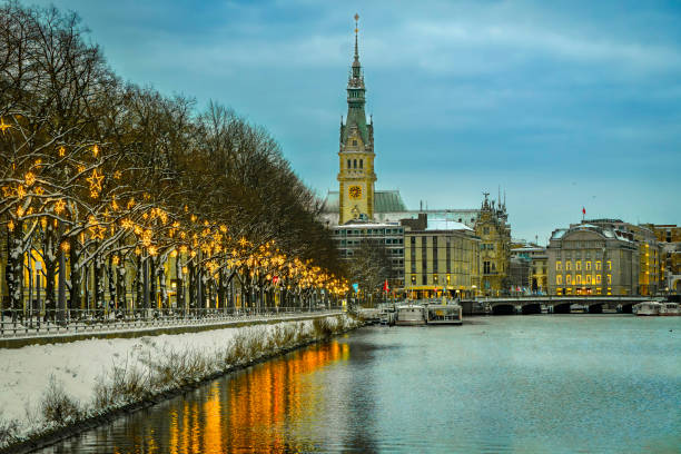 Christmas-lit Ballindamm towards the town hall in Hamburg View along the Christmas-lit Ballindamm towards the town hall in Hamburg, reflections in the water, horizontally sterne stock pictures, royalty-free photos & images