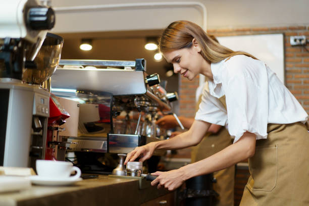 istock Female barista making a coffee. 2055726453