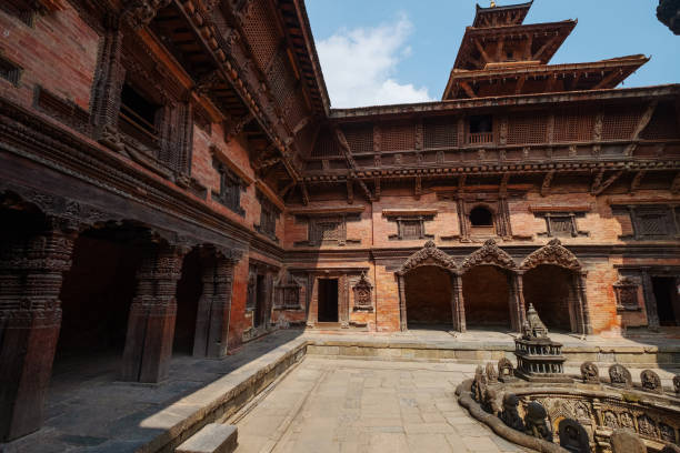 Real architecture masterpiece of old temple inside Yard view Tusha Hiti or Royal Bath in Sundari Chowk, Patan Durbar Square royal medieval palace and UNESCO World Heritage Site. Lalitpur, Nepal