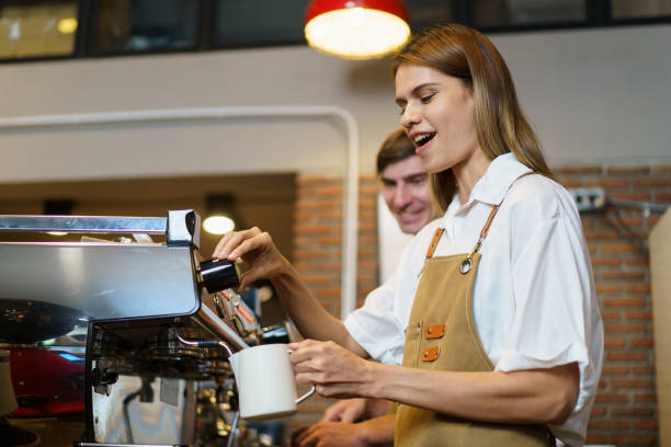 istock Female barista making a coffee. 2055730126