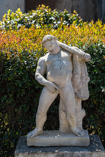 Ancient statues in a private garden of a typical Roman villa in Herculaneum, Italy