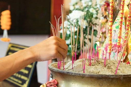 Lighting incense to pay homage to sacred things and ask for blessings from the gods on important days