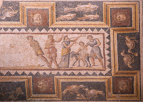 Revelers and attendants of Dionysus' drinking contest. The mosaic is part of a floor located in the House of Dionysus.4th-century Roman mosaic.Zippori (Tzipori) National Park,Israel