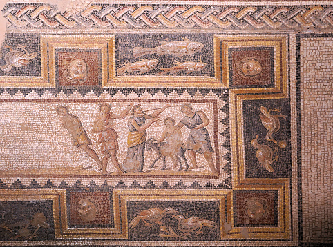 Revelers and attendants of Dionysus' drinking contest. The mosaic is part of a floor located in the House of Dionysus.4th-century Roman mosaic.Zippori (Tzipori) National Park,Israel