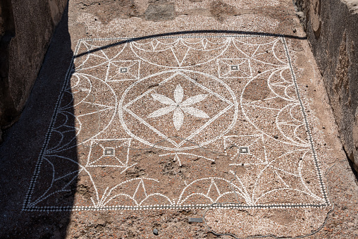 Beautiful geometrically formed floral mosaic, Pompeii in Italy