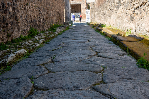 A beautiful typical cobbled street in the ancient city of Pompeii, Southern Italy