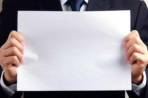 Man hand holding blank paper
