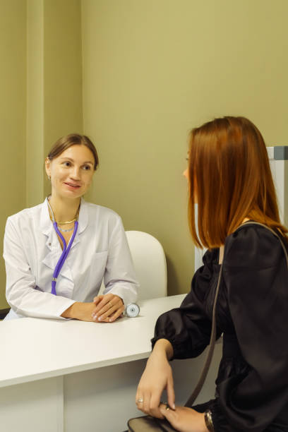 istock Doctor with patient in medical office 2055813487