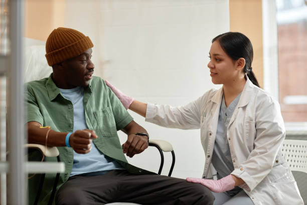 Smiling Doctor Comforting Patient in Clinic