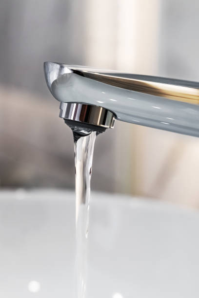 istock Water flow from chromed steel faucet 2055867543