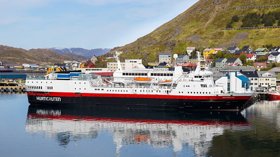 Honningsvåg, Norway - June 11, 2023: Hurtigruten postal cruise at the pier in Honningsvag near the North Cape in Norway