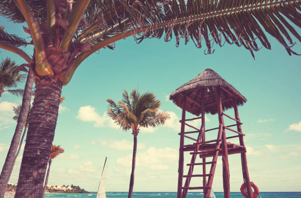 istock Lifeguard tower at a tropical beach, color toning applied. 2055890292