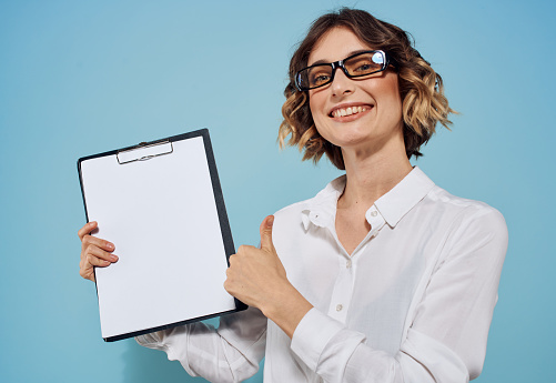 Business woman with document folder white sheet of paper business mockup. High quality photo