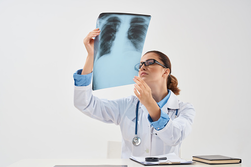 woman doctor radiologist x-ray diagnostics lung treatment. High quality photo