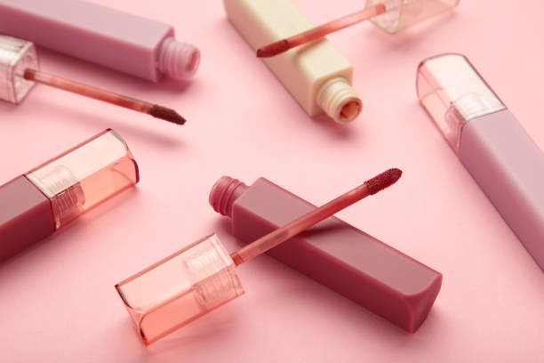 istock Beautiful lip glosses on a pink background 2055942295