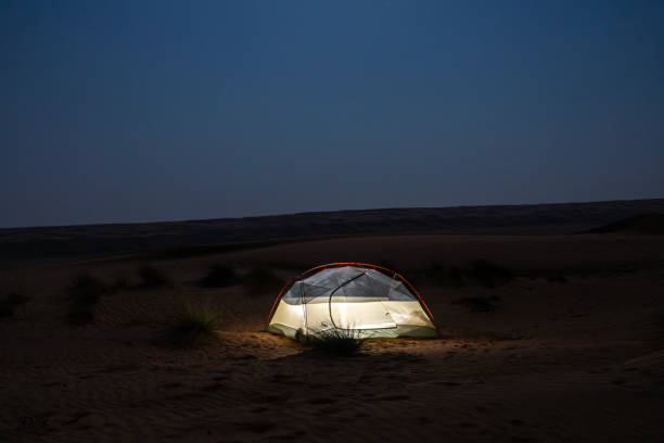 istock Illuminated tent in Wahiba desert at night, Oman 2055945511