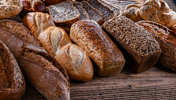 istock Assorted bakery products including loaves of bread and rolls 2055964878