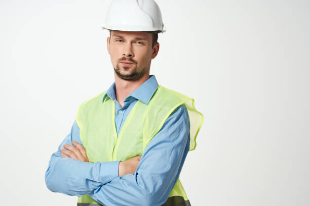 istock man in construction uniform white helmet safety studio 2055996822