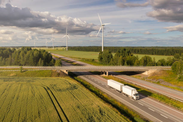 Highway transport in a rural landscape with wind power stations