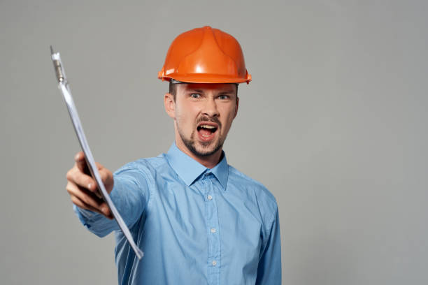 istock man in construction uniform protection isolated background 2056013391