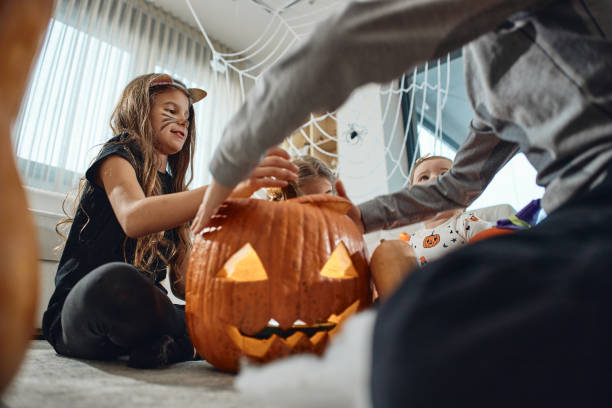 istock A group of children playing hocus pocus on a Halloween day 2056014448