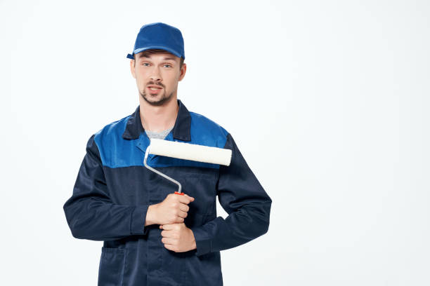 istock man in working uniform repair decoration work painter 2056025928