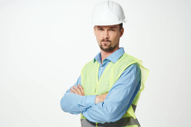 istock man in construction uniform white helmet safety studio 2056032260