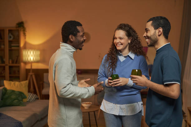 istock Friends Enjoying Drinks at House Party 2056046938