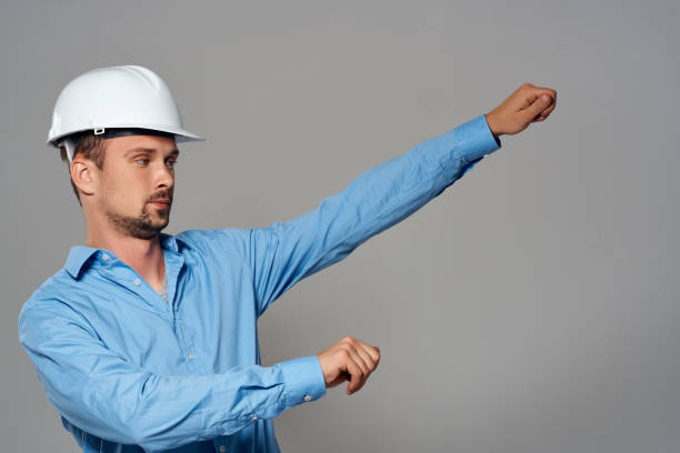 emotional man in construction helmet engineer work industry. High quality photo