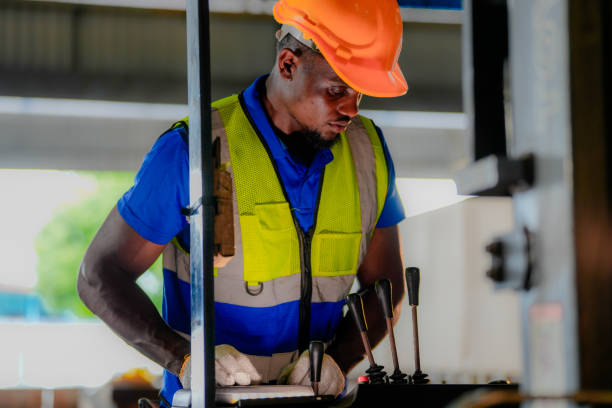istock factory man driving forklift car working in distribution warehouse. factory worker teammates working beside stacks of cargo. Group of Diversity engineer factory people meeting. 2056073003